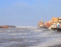 Sacred Gomti River meeting the Ocean, Indian Traditional Ghats and Hindu Temple at Distance - Devbhoomi Dwarka, Gujarat, India