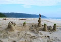 Fun at Beach - Sand Castle with Blue Ocean and Sky in Background - Leisure, Play and Activity Royalty Free Stock Photo