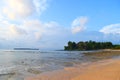 Sandy Beach, Calm Sea Waters, Greenery, Distant Island, & White Clouds in Blue Sky - Sitapur, Neil Island, Andaman Nicobar, India Royalty Free Stock Photo