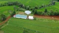 The Serene Beauty of Green Fields, Fruitful Orchards, and Traditional Village Life Royalty Free Stock Photo