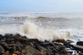 Spray of Water Drops with Hitting of Sea Wave to Rocks on Shore - Ocean Natural Aqua Background Royalty Free Stock Photo