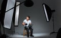 Photograph sitting on the chair in professinal studio