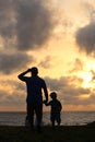 Photograph of a son and father enjoying the sun set good for fathers day celebration