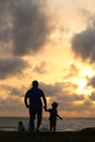 Photograph of a son and father enjoying the sun set good for fathers day celebration