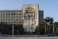 Square in Cuba with a portrait of Che Guevara on the house