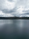Photograph taken in Castel Gandolfo, Italy, from an elevated perspective, capturing a view of the lake and mountains