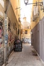 Photograph taken in the city of Cagliari, Italy, showcasing the picturesque and lengthy alleys of the city