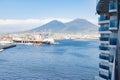 Photograph taken in Naples, Italy, featuring a view of Mount Vesuvius and the sea, captured from a cruise ship