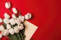 Photograph Of Top View Of Copy Space And Red Envelope And Bouquet Of White Tulips With Copy Paste Red Background. Generative AI