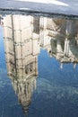 photograph of the tourist tower of the cathedral of Toledo, Spain reflected in the water of a nearby lake fountain Royalty Free Stock Photo