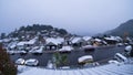 This photograph was taken out of my window. It was a very cold winter day in New Zealand. Thick snow covered rooftop, cars and