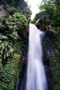 Tranquil Scene of A Waterfall Cascading Down, West Java, Indonesia Royalty Free Stock Photo