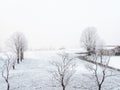 Photograph of a white, snowy landscape before sunrise in Kitzbuhel, Austria