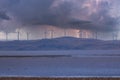 Photograph of Wind Turbines on a hill during a lightning storm Royalty Free Stock Photo