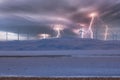 Photograph of Wind Turbines on a hill during a lightning storm Royalty Free Stock Photo