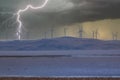 Photograph of Wind Turbines on a hill during a lightning storm Royalty Free Stock Photo