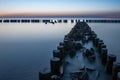 Wooden breakwater at sunset on the Baltic Sea Royalty Free Stock Photo