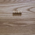 Wooden letters spelling July on a wooden background