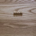 Wooden letters spelling June on a wooden background