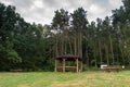 Wooden rest place in front of woods Royalty Free Stock Photo