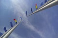 Looking Up to Europe â EU and Romanian Flags in the Wind at Neptun Beach, A Perspective on Unity and Aspiration Royalty Free Stock Photo