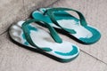 A photographed from the left angle of a pair of worn rubber sandals Royalty Free Stock Photo