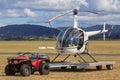 A Robinson R22 light utility trailer being towed on a trailer