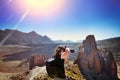 Photographer in action with his team during sunset on rocky mountain. Adventure travel concept. Tenerife Royalty Free Stock Photo