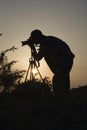 Photographer in action silhouette Royalty Free Stock Photo