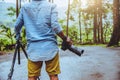 Photographer asian man travel  nature. Travel relax. Nature Study. At public park in summer. National park doi inthanon in Royalty Free Stock Photo