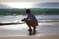 Photographer on a beach Royalty Free Stock Photo