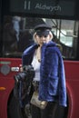 Photographer in blue fur coat from faux fur