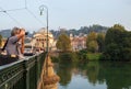 Photographer on the bridge in Turin with Gran Madre and river Po