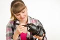 Photographer brush cleans the front of the lens on the camera