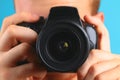 photographer with camera in hand looking through the camera lens. Royalty Free Stock Photo