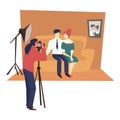 Photographer with camera and studio, family photoshoot, married couple on couch Royalty Free Stock Photo