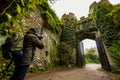 photographer capturing ivycovered castle gate Royalty Free Stock Photo