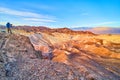 Photographer capturing stunning sunrise in majestic desert mountains of Death Valley