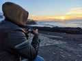 Photographer capturing a sunset