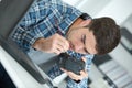 Photographer cleaning photocamera light sensor