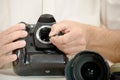 Photographer cleaning sensor of his camera Royalty Free Stock Photo