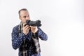 Photographer with digital reflex camera. Copy space at white background