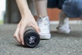 Photographer dropped a photo lens on the asphalt, glass falls to the ground, close-up of a broken lens on the street