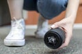 Photographer dropped a photo lens on the asphalt, glass falls to the ground, close-up of a broken lens on the street