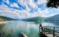 Photographer female on the lake Vidraru Carpathians Romania Royalty Free Stock Photo