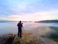 Photographer framing picture with eye on viewfinder. Photo enthusiast enjoy work, fall nature