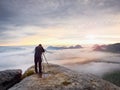 Photographer framing picture with eye on viewfinder. Photo enthusiast enjoy work, fall nature