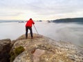 Photographer framing picture with eye on viewfinder. Photo enthusiast enjoy work, fall nature