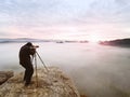 Photographer framing picture with eye on viewfinder. Photo enthusiast enjoy work, fall nature