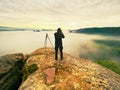 Photographer framing picture with eye on viewfinder. Photo enthusiast enjoy work, fall nature